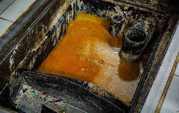 neglecting grease trap cleaning can result in foul odors, clogs, and even fines for non-compliance with regulations